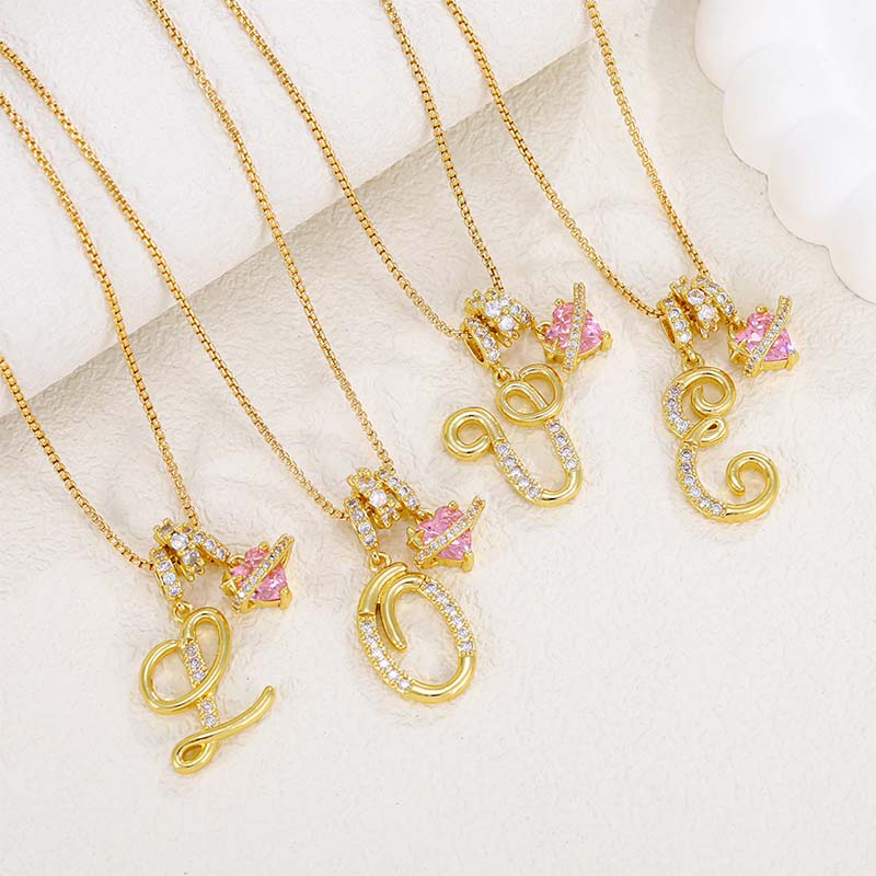 Collier avec initiale et breloque cœur rose