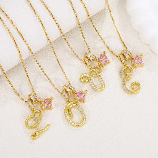 Collier avec initiale et breloque cœur rose