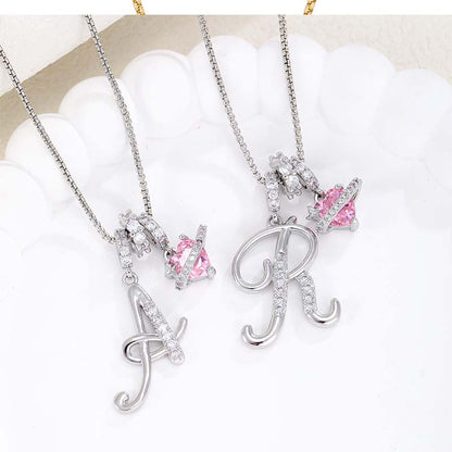 Collier avec initiale et breloque cœur rose