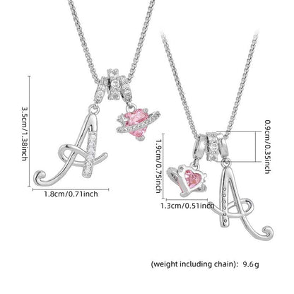 Collier avec initiale et breloque cœur rose